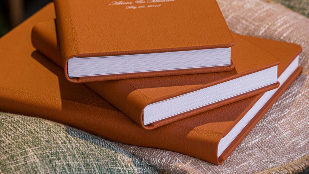 Brown leather wedding albums with rounded bindings