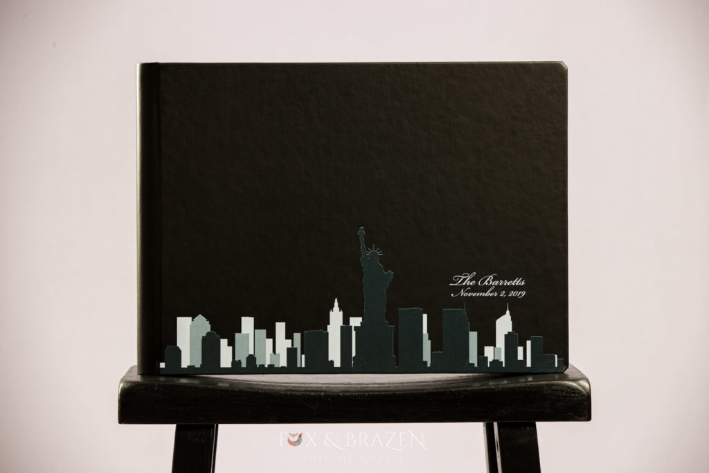 Black wedding album with New York City Skyline on cover