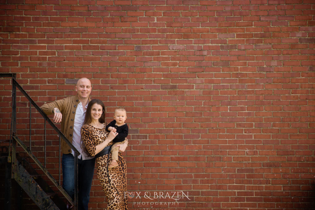 Family at Mini session against brick wall