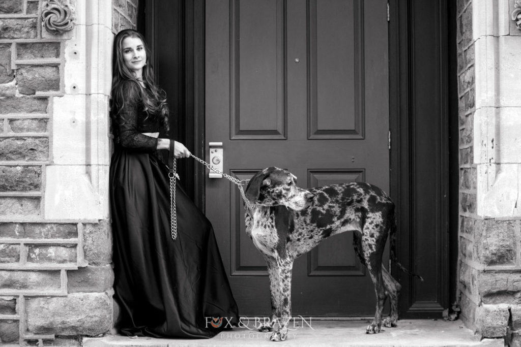 Woman holding leash for great dane
