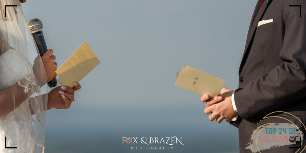 hands of bride and groom sharing quiet vows during their ceremony.