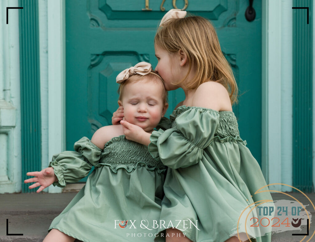 Two siblings hugging during an outdoor family session.