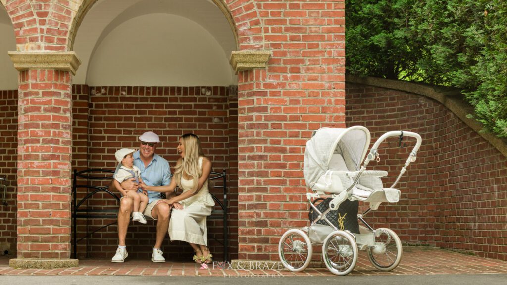 Family enjoying togetherness at Longwood Gardens with baby buggy in the summer