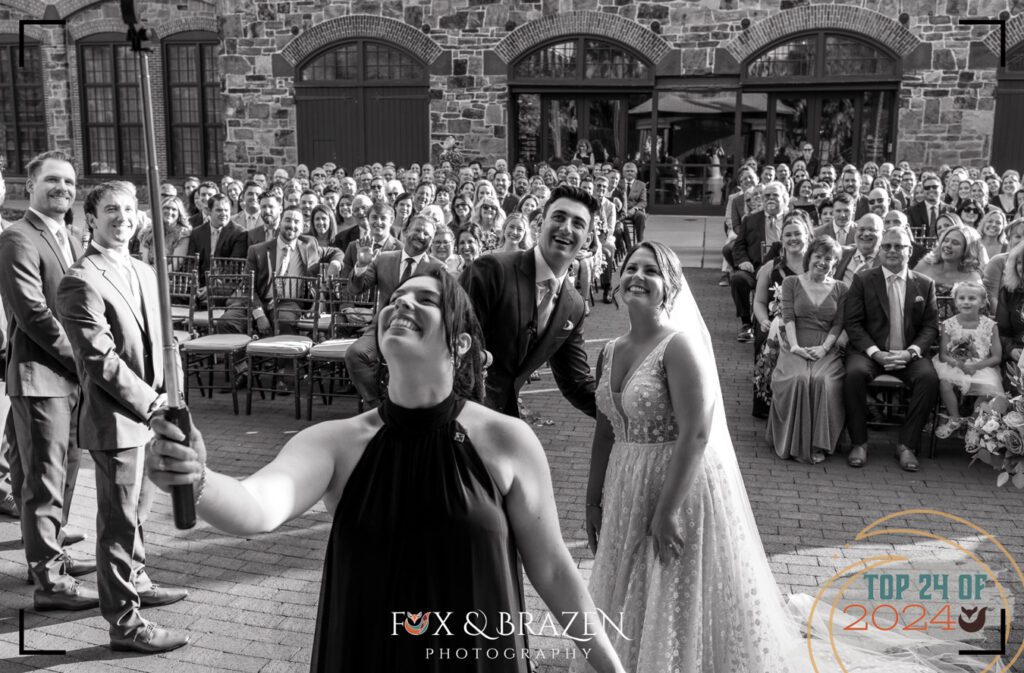 Officiant leading a selfie at the Phoenixville Foundry wedding ceremony.