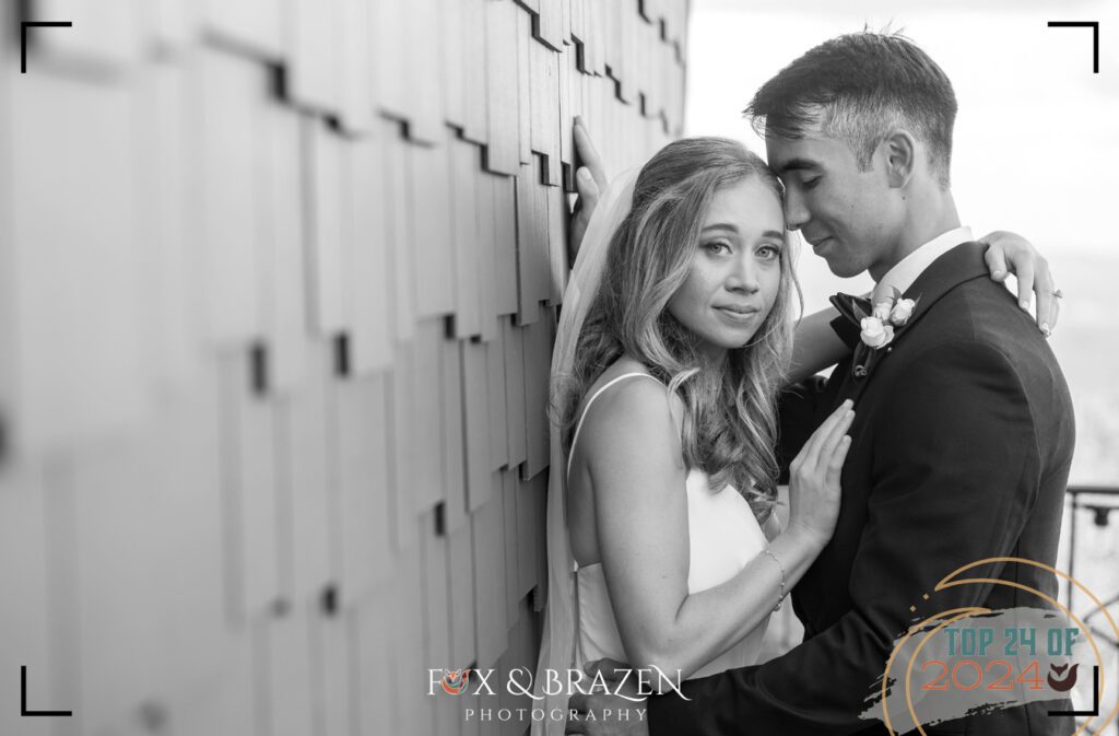 Bride and groom in black-and-white at Blue Mountain, sharing a quiet moment in 2024.